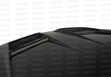 Load image into Gallery viewer, Seibon Carbon HD1011VWGTIB-DV DV-style Carbon Fiber Hood For 2010-2014 VW Golf / GTI (Shaved)