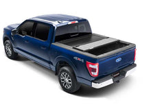 Load image into Gallery viewer, 21-26 F-150 RealTruck UnderCover Ultra Flex Hard Folding Tonneau Cover - 5.5 ft Bed